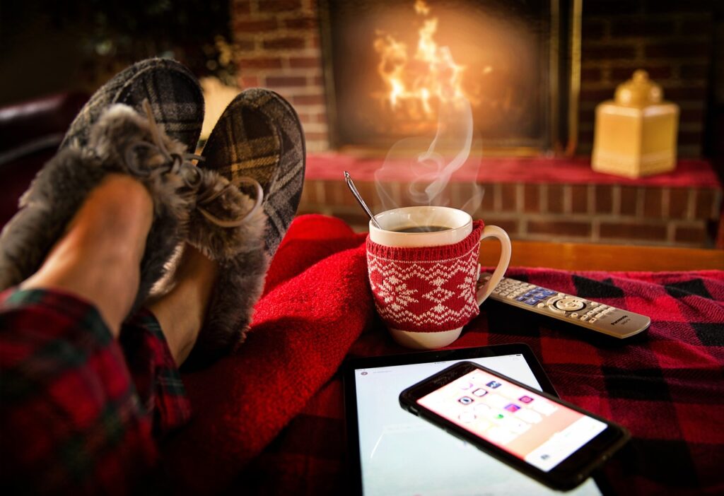 relaxing in front of fireplace with cocoa