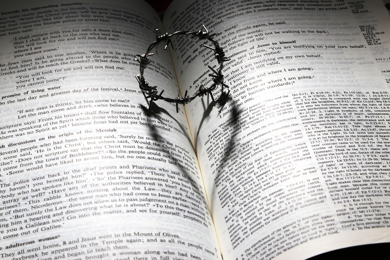 Bible with crown of thorns