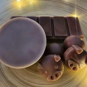 sherlock and Watson wax melts. Brown in color tarts, pigs and dots
